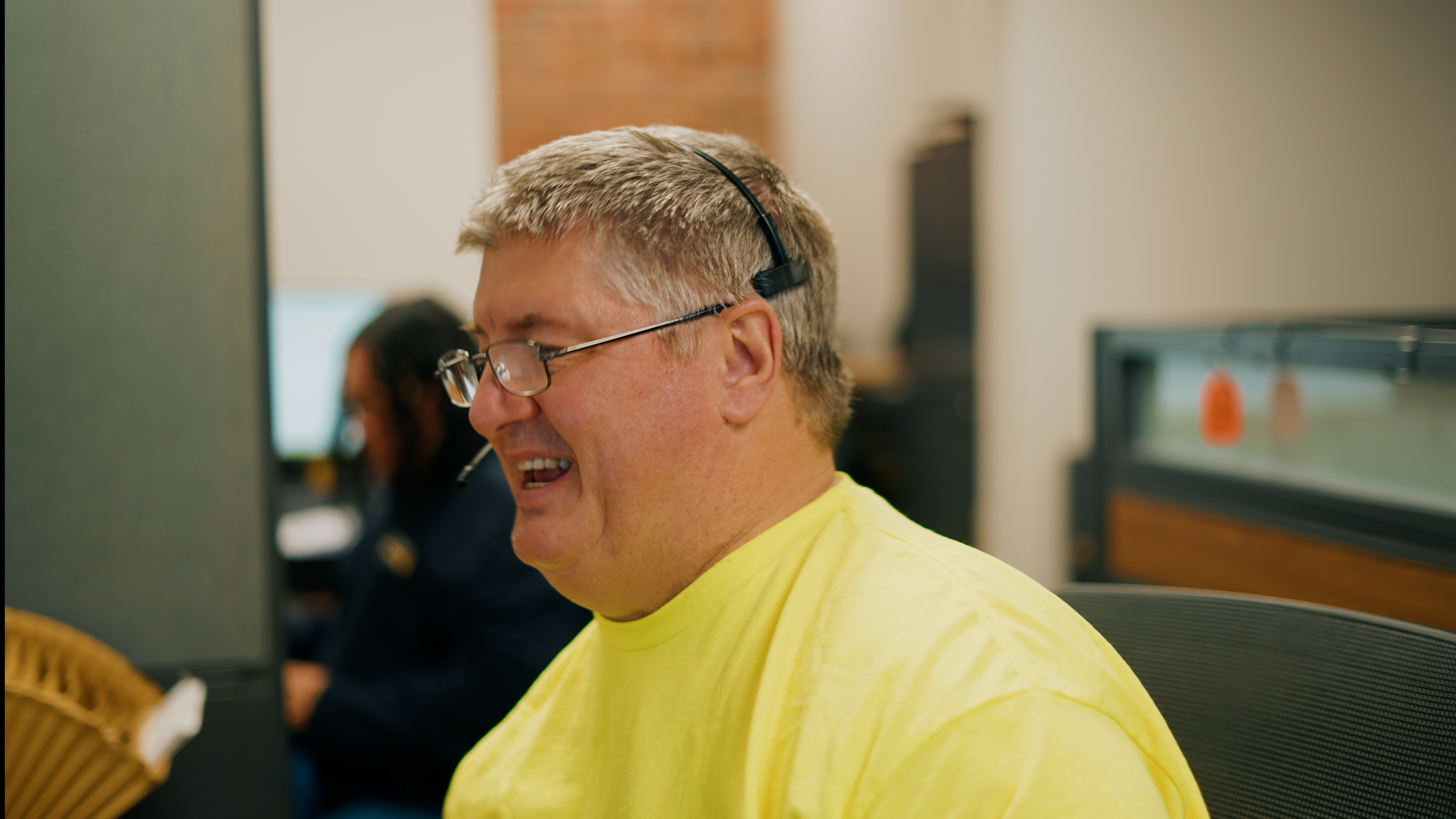 Team member wearing an orange safety vest